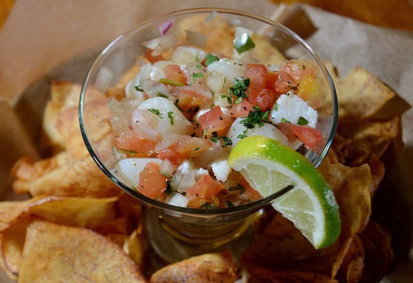 Ceviche, made of conch, shrimp, scallops and whitefish, is served with taro chips. - TOM HELLAUER