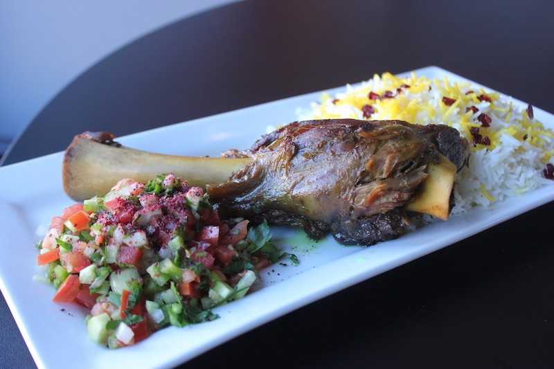 Sultan's lamb shank comes with rice and vegetable salad for $14.95. - SARAH FENSKE