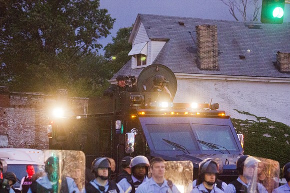 Protesters and residents were outraged at  the presence of armored police vehicles and heavily armed officers.