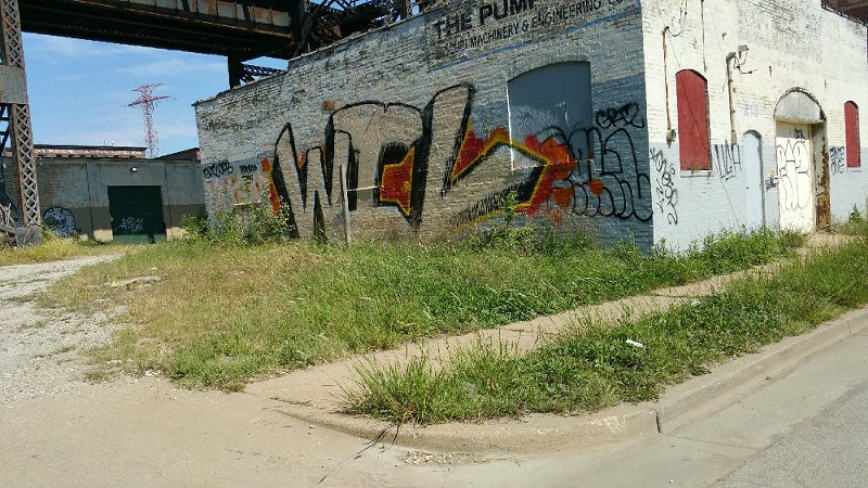 Graffiti artists "bombed" the city, Harrington says, with vandalism like that depicted above. - Photo by John Harrington