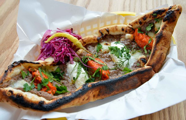 The pide features a choice of beef, chicken, veggie or cheese with ajvar, kajmak, herbs and cabbage salad. - TOM HELLAUER