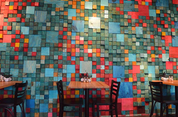Loryn Nalic and a friend sawed and colored over 2,000 pieces of wood to make this decorative wall. - TOM HELLAUER