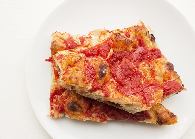 Perfectly simple "Pizza Rossa" features tomatoes and chile oil. - MABEL SUEN