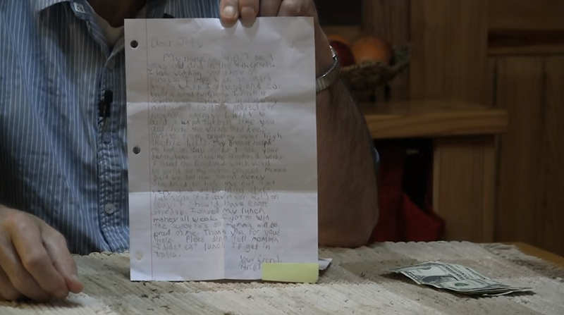 A close-up of the letter and cash mailed by a fan. - YOUTUBE