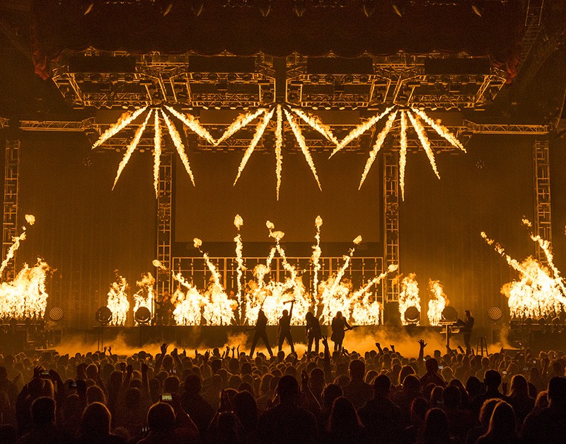 Lights, lasers, smoke and fire all contribute to the over-the-top show. - Jason McEachern