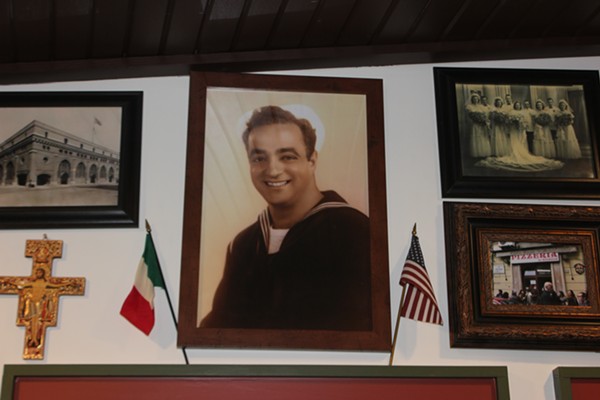A portrait of the pizzeria's namesake, Carmelo Valenza, keeps watch over the place. - Cheryl Baehr