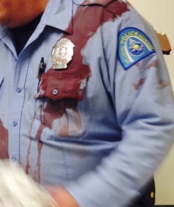 After a tragic night, Don Re snapped this photo of an officer's bloodied uniform. "This is what a good policeman looks like," he wrote on Facebook. - PHOTO COURTESY OF DON RE