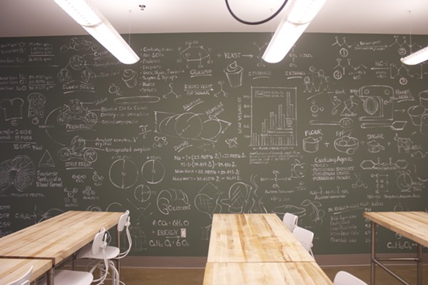 Chalk boards are covered with illustrations and diagrams. - Photo by Cheryl Baehr