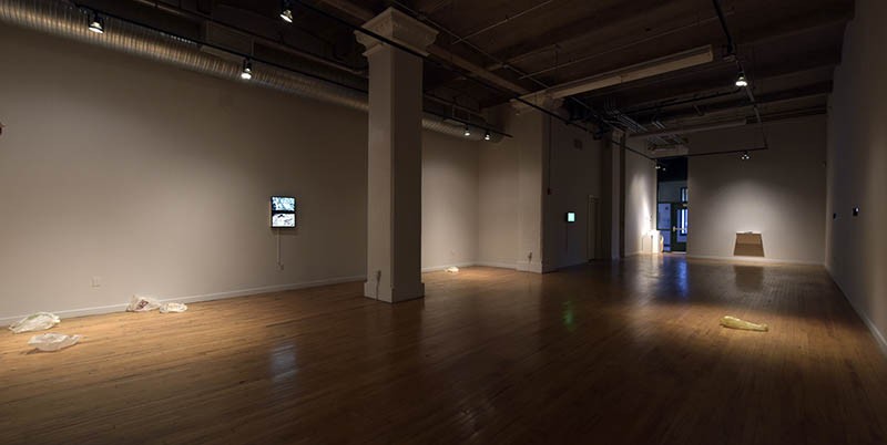 A scene of the Des Lee Gallery with Uncanny on display.
