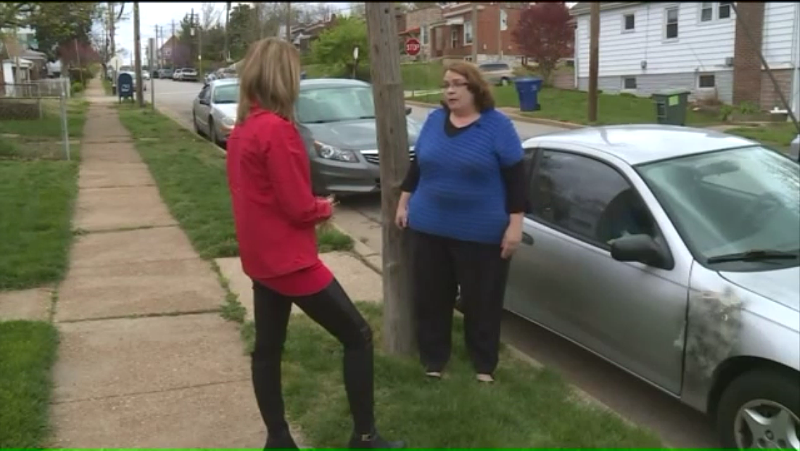 Marianne Power (right) tells Fox 2 reporter Erika Tallan about her run in with a dent repair con man. - IMAGE VIA FOX 2