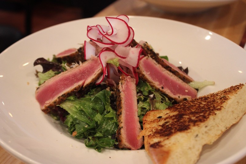 The sesame-crusted tuna salad comes topped with an orange-soy vinaigrette. - PHOTO BY SARAH FENSKE