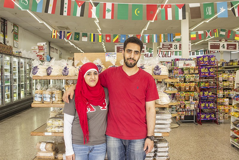 Siblings Ayah and Mohamad Sumren in the grocery store, which sells the family's from-scratch breads. - PHOTO BY MABEL SUEN