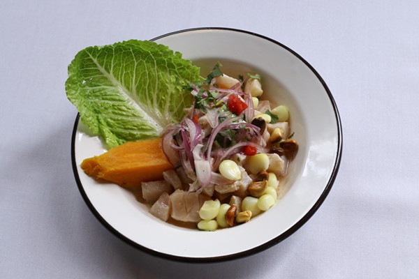 Cocina Latina's ceviche features fish slices marinated in lime juice and seasoned with aji limo pepper, cilantro, garlic, and red onions. - CHELSEA NEULING