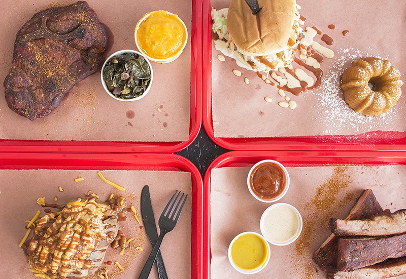 A selection of items from Big Baby Q: thick-cut pork steak, the Big Baby sandwich, loaded smokehouse potato and ribs. - PHOTO BY MABEL SUEN