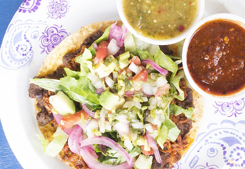 Sabor Si’s “Dirty Pig” tostada employs black beans, lettuce and pineapple pork. - PHOTO BY MABEL SUEN