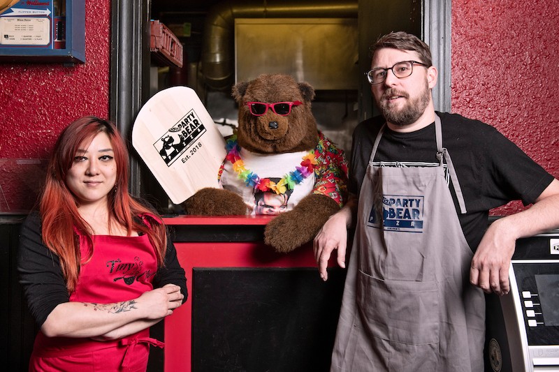 Melanie Meyer, left, and Chris Ward with their new eatery's eponymous mascot. - COREY WOODRUFF