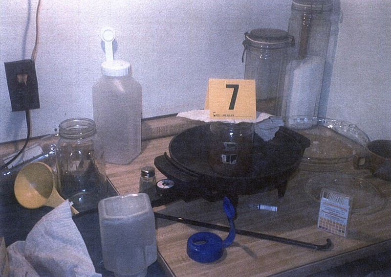Police photos from a November 2002 raid on Tim's trailer show the detritus of a meth lab. - COURTESY OF THE PROSSER FAMILY