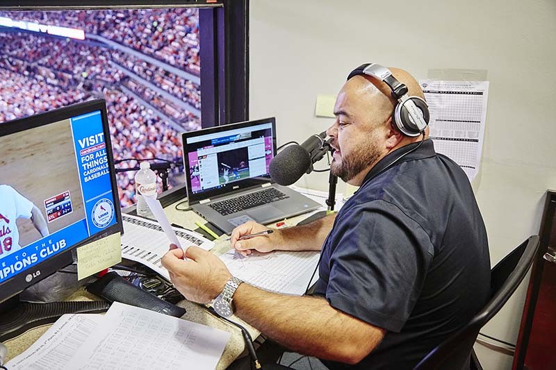 Polo Ascencio calls the Cardinals-Pirates game in Spanish. - PHOTO BY STEVE TRUESDELL