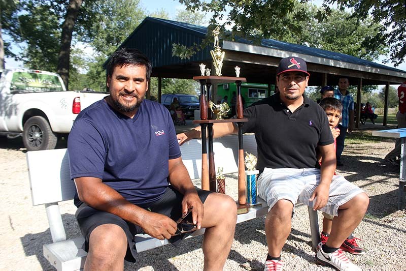 Oscar (left) and Alberto Pasadas run a Latino baseball league in St. Charles County. - PHOTO BY DOYLE MURPHY
