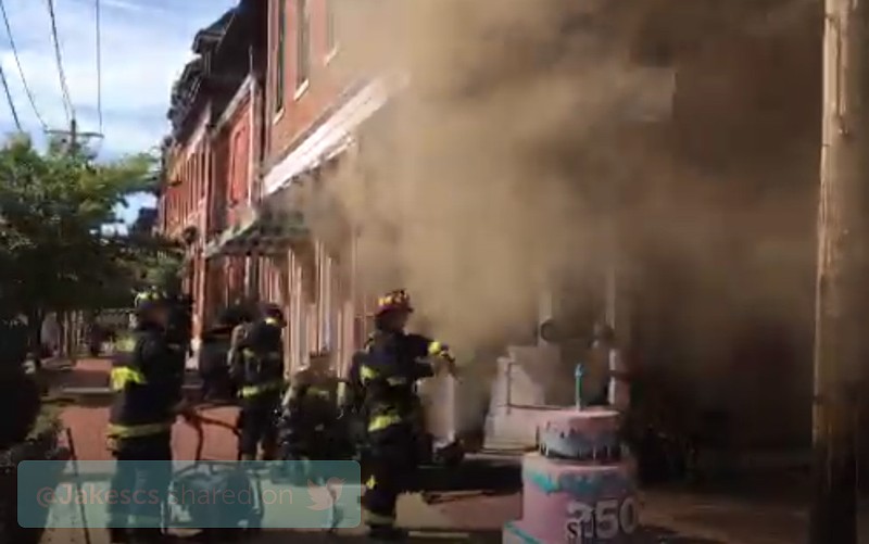 Firefighters work to put out a fire at Sweet Divine in Soulard. - Image via St. Louis Fire Department/Periscope