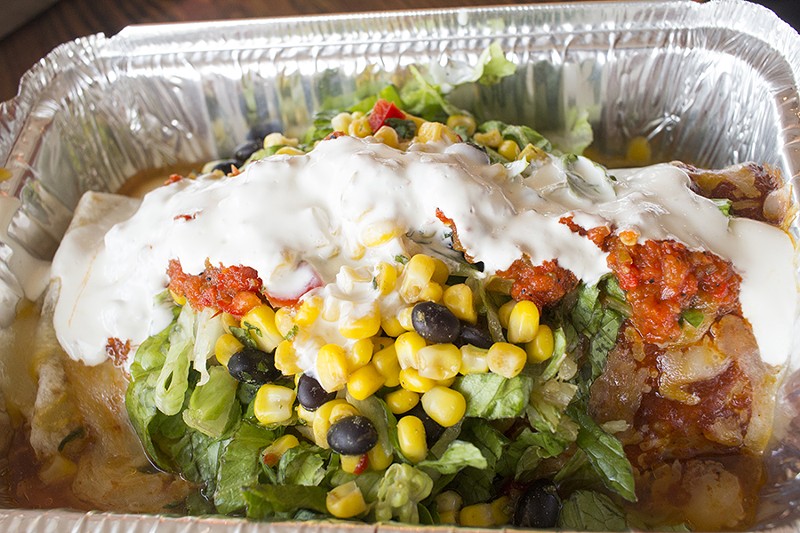 A steak and black bean-filled wet burrito with lettuce, corn, black-bean salsa, roasted red-pepper salsa and sour cream. - PHOTO BY MABEL SUEN