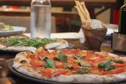 The Margherita, foreground, shows the classic Neapolitan charring. - PHOTO BY SARAH FENSKE