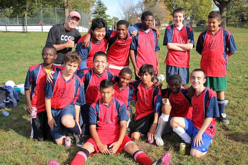 Coach DJ Wilson with a soccer team at Cabrini Academy, circa 2011. - THOMAS CRONE