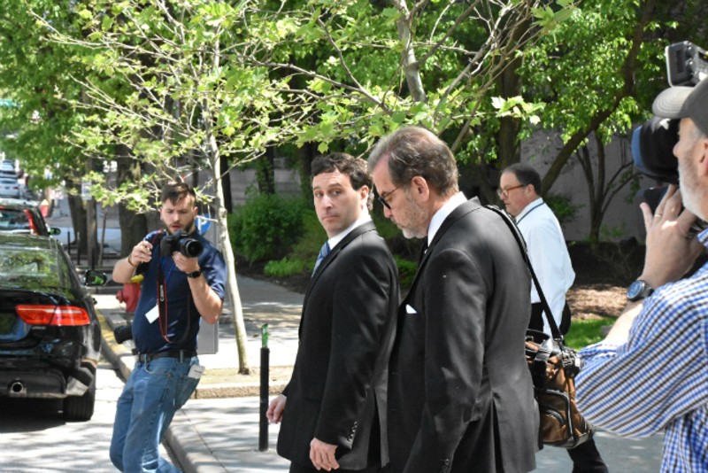 Steve Stenger (right) leaves the federal courthouse with his attorney, Scott Rosenblum. - DOYLE MURPHY
