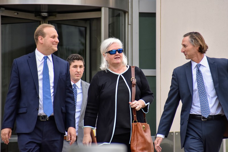 Sheila Sweeney leaves federal court with her attorneys after pleading guilty in a public corruption case. - DOYLE MURPHY