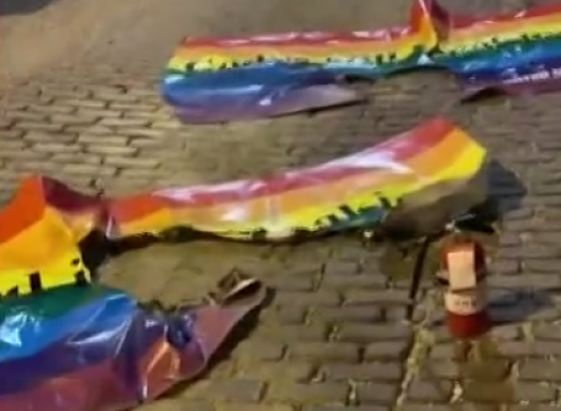 A pair of rainbow flags were burned behind Rehab Bar & Grill in the Grove in one incident. - SCREENSHOT FROM KSDK'S REPORT