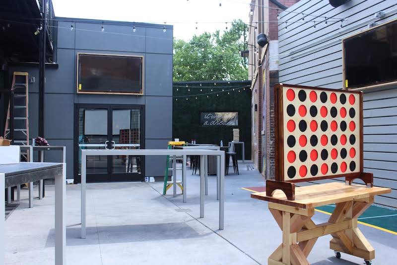 The newly created patio offers games including giant Connect 4. - KATIE COUNTS