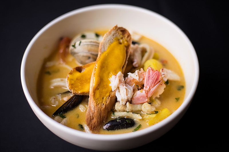 The Marseille seafood stew is studded with shrimp, clams, mussels, squid, crab, monkfish and sole. - MABEL SUEN