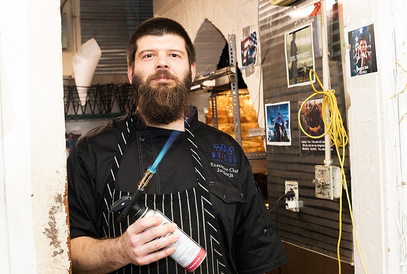 Executive chef Jon Dreja in his Tom Cruise-adorned kitchen, dubbed “the Danger Zone." - MABEL SUEN