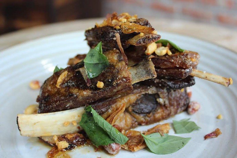 Lamb ribs garnished with candied peanuts will be served at Indo. - KATIE COUNTS