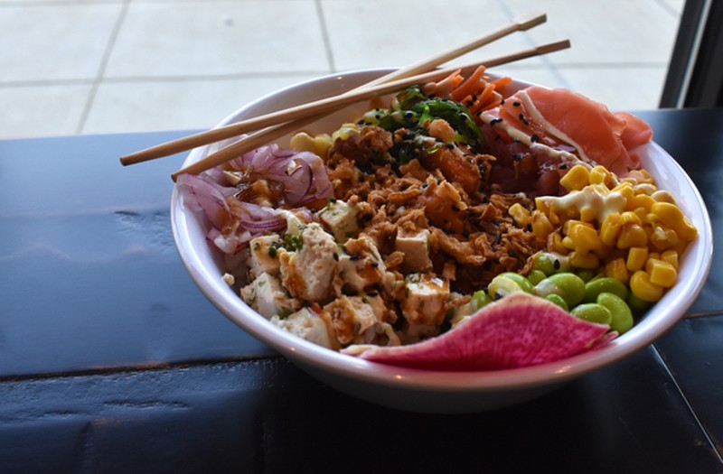 A build-your-own poke bowl with ahi tuna, herb tofu, spicy salmon, edamame, seaweed salad, ginger, red onion, pineapple, watermelon radish and corn. - Liz Miller