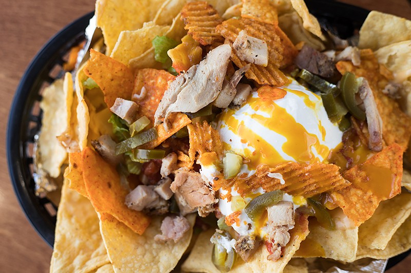 The "Uppercut" nachos come topped with chicken and turkey. - MABEL SUEN