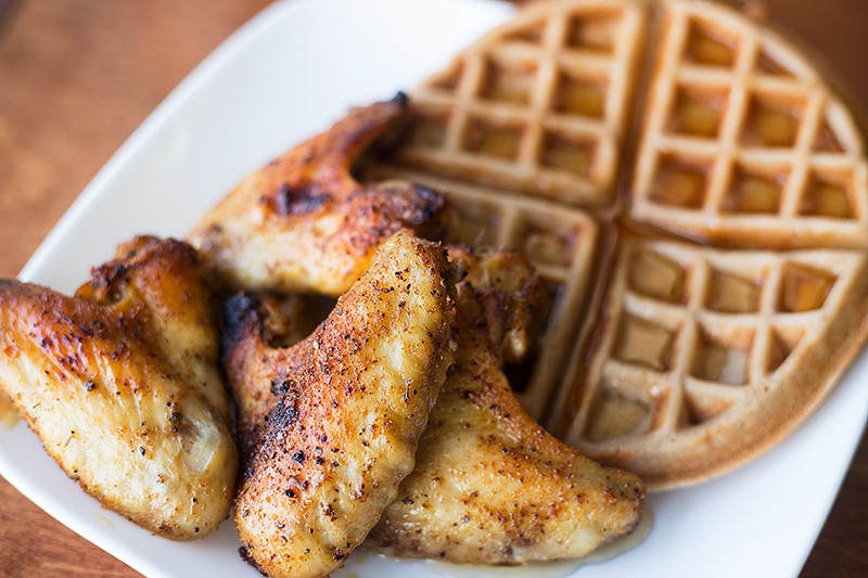 The "Pluck 'N' Waffles" plates three chicken wings atop a fluffy waffle. - MABEL SUEN