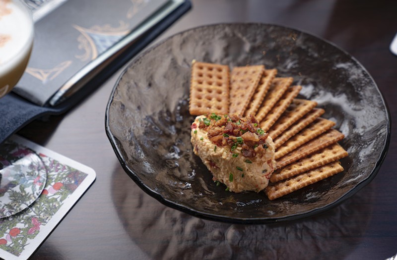 Whipped pimento spread with fried crackers, country ham cracklings, pepper and chives. - Courtesy of Lodging Hospitality Management