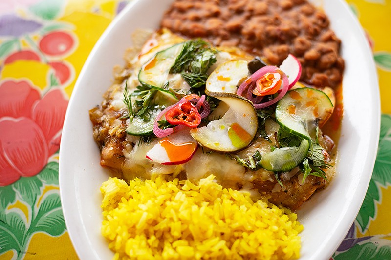 Enchiladas with chicken, corn tortillas, salsa verde, crema and cotija cheese. - MABEL SUEN