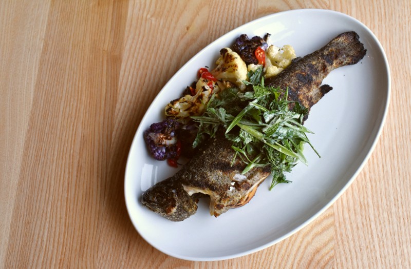 Grilled whole trout with herb salsa verde, grilled lemon, grilled cauliflower and pickled chiles. - LIZ MILLER