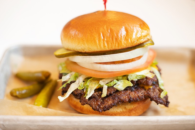 A griddled double cheeseburger with American cheese, lettuce, tomato, onion, pickles and sport peppers. - MABEL SUEN