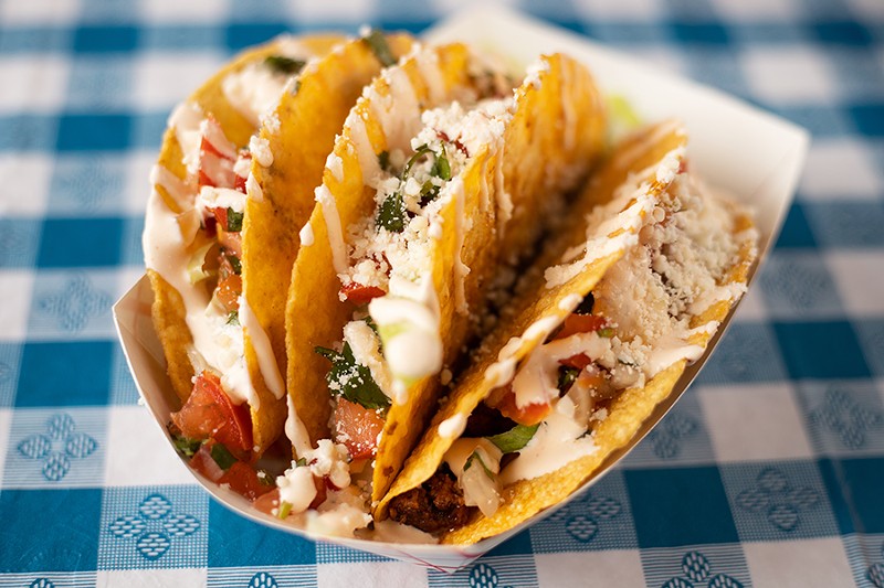 The Mom Taco with ground chuck, lime cabbage, pico de gallo and sour cream in a crispy corn tortilla. - MABEL SUEN