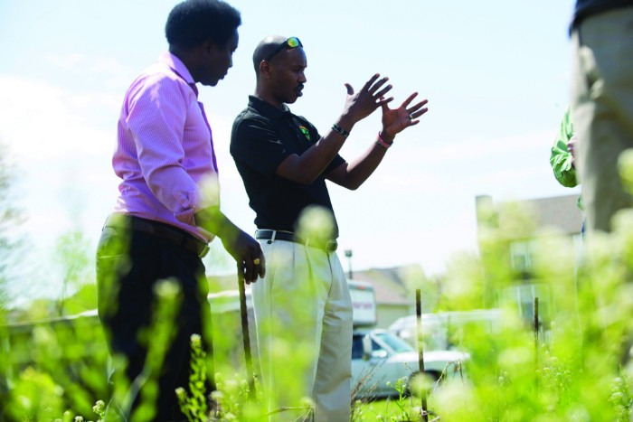 Pastor Paul Macharia and Geoffrey Soyiantet in the garden. - TRENTON ALMGREN-DAVIS