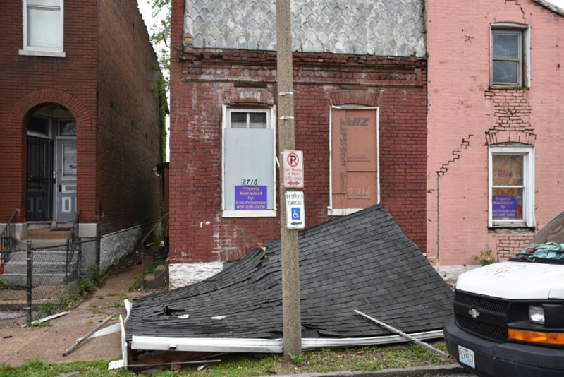 A roof was down on the sidewalk in front of a Utah Street house. - DOYLE MURPHY