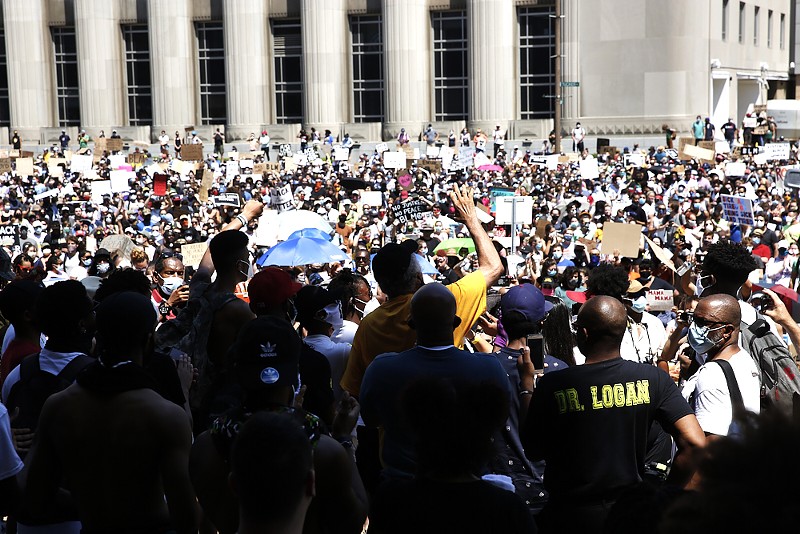 Protesters fill the street and sidewalks on June 7, 2020, outside the St. Louis Justice Center. - THEO WELLING
