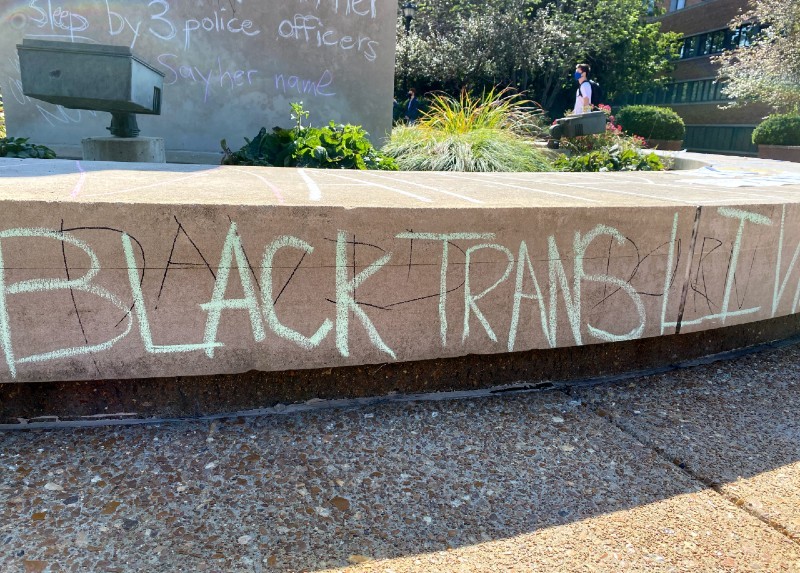 Students attempted to cover "David Dorn," written in permanent marker, with the words, "Black Trans Lives Matter" in chalk on the base of the Clock Tower. - RILEY MACK