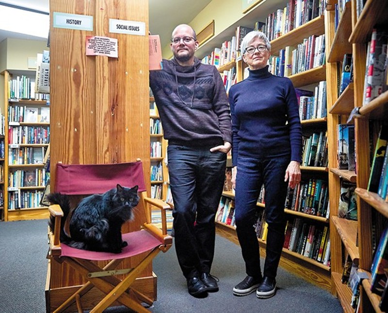 Left Bank Books co-owners Jarek Steele and Kris Kleindienst with Spike, the shop cat. - THEO WELLING