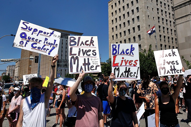 Thousands of protesters marched in downtown St. Louis last summer in an act of solidarity against police violence. - THEO WELLING