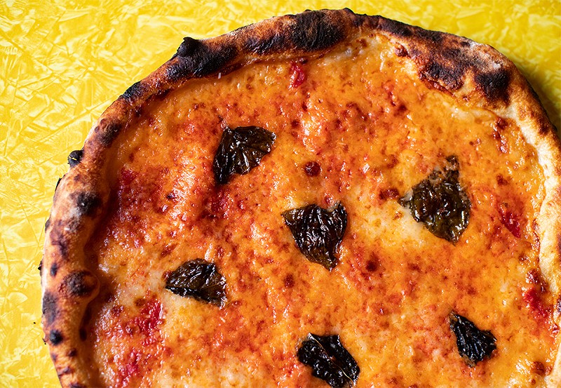 Margherita pizza with housemade fresh mozzarella, low-moisture mozzarella, tomato sauce, basil and parmesan. - MABEL SUEN
