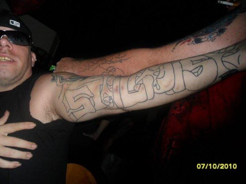 Samuel Israelsen's distinctive "St. Louis" tattoo helped investigators identify him. - COURTESY NamUS DATABASE